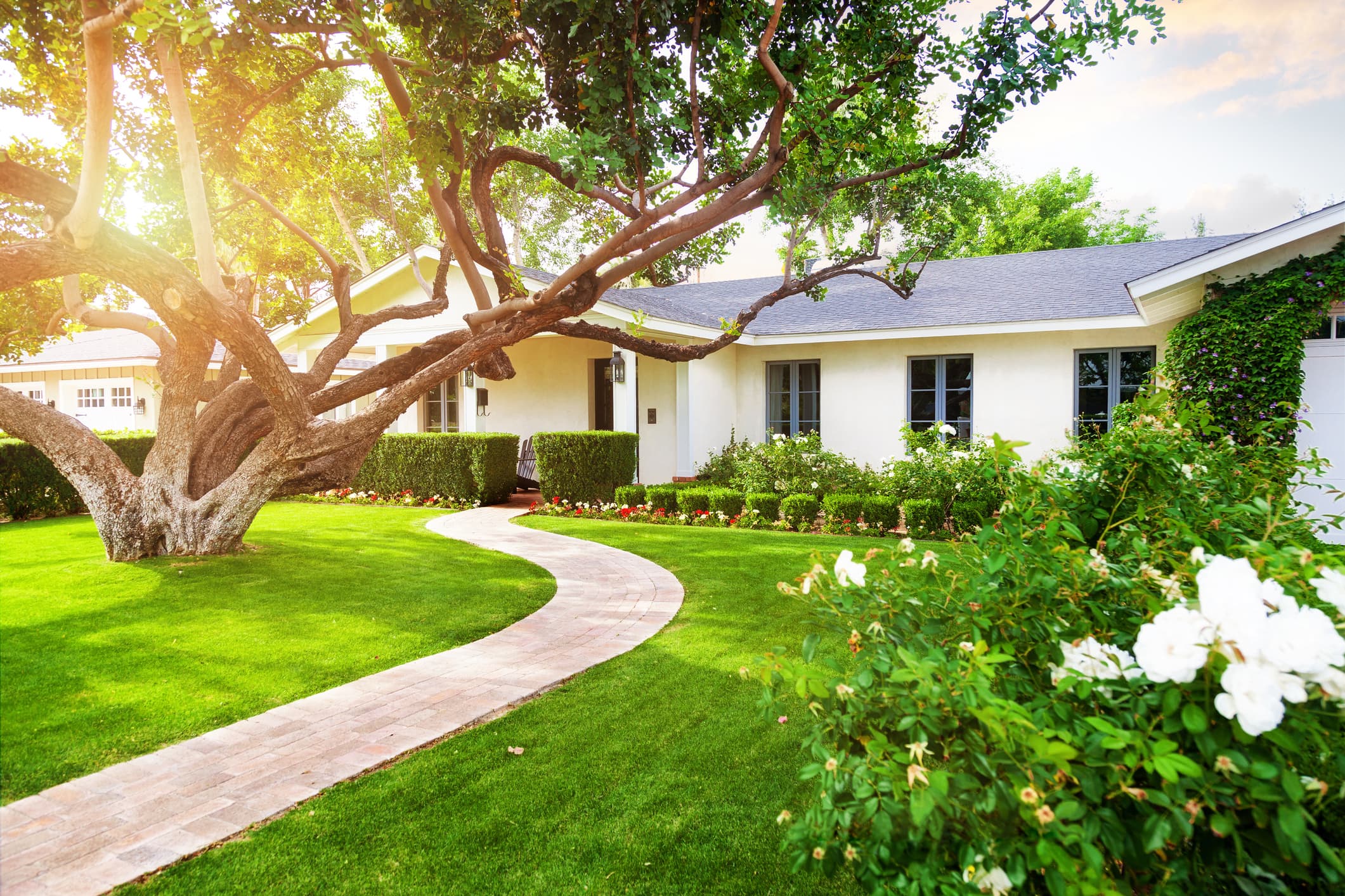A home with a Kelley Blue Book Homes for-sale sign in the front yard
